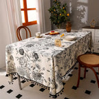 Black Floral Tasseled Farmhouse Tablecloth — product in use