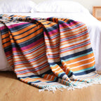Rainbow Striped Tassel Blanket — product in use