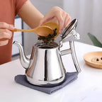 Stainless Steel Kettle with Built-in Filter — product in use