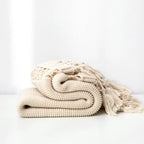 Snug Knit Woven Tassel Blanket — product detail view