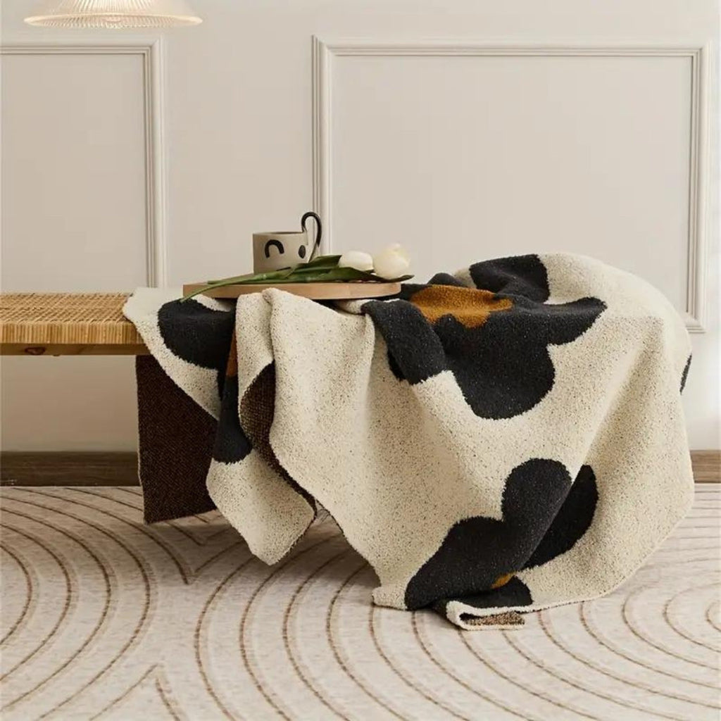 Aurora Bloom | Floral Knitted Blanket — product in use