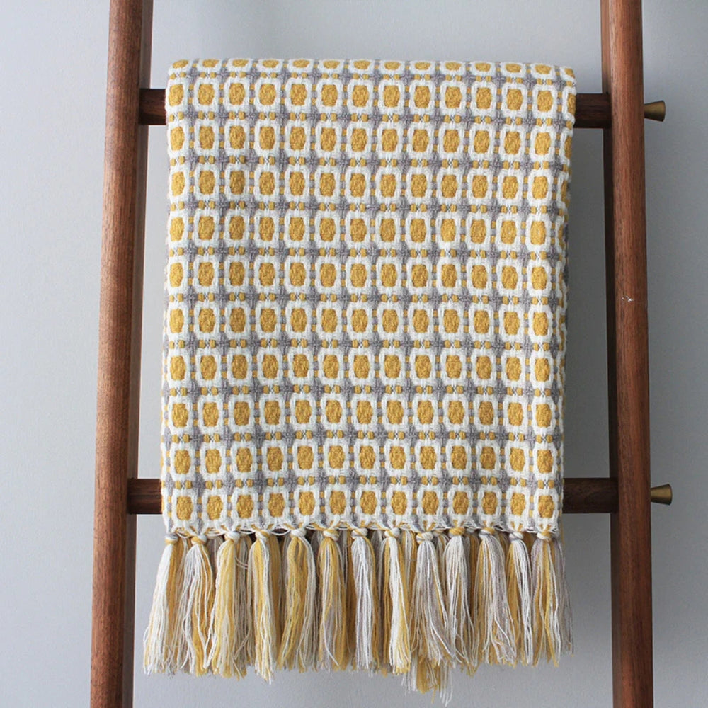 Knitted Couch Blanket with Tassels — product in use