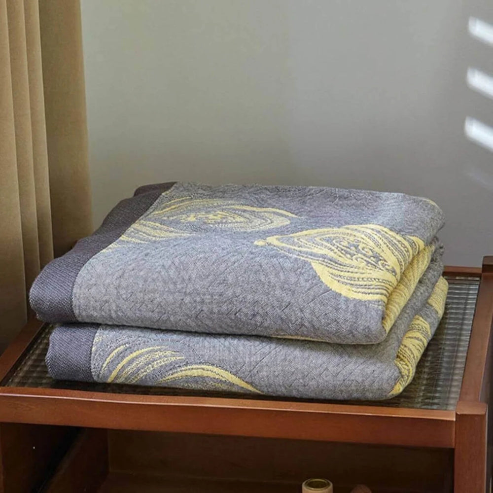 Feather Print Bamboo Fiber Reversible Blanket — lifestyle shot