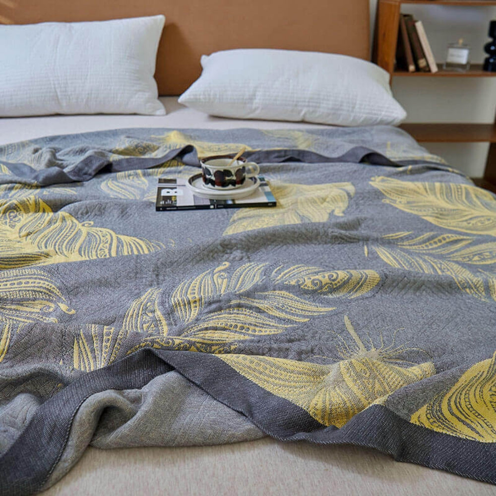Feather Print Bamboo Fiber Reversible Blanket — product in use