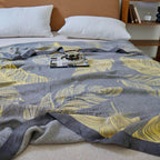 Feather Print Bamboo Fiber Reversible Blanket — product in use