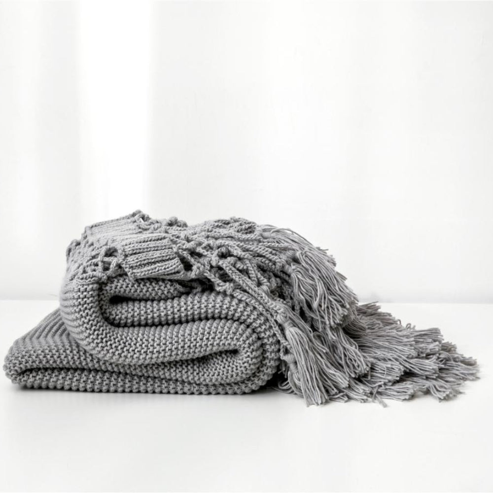 Snug Knit Woven Tassel Blanket — product in use