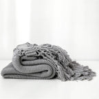 Snug Knit Woven Tassel Blanket — product in use
