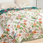 Botanic Bluebird Reversible Cotton Blanket — product in use