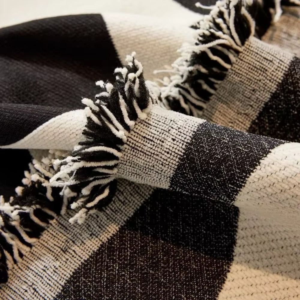 Chess Board Chic Tasseled Sofa Cover — product close-up