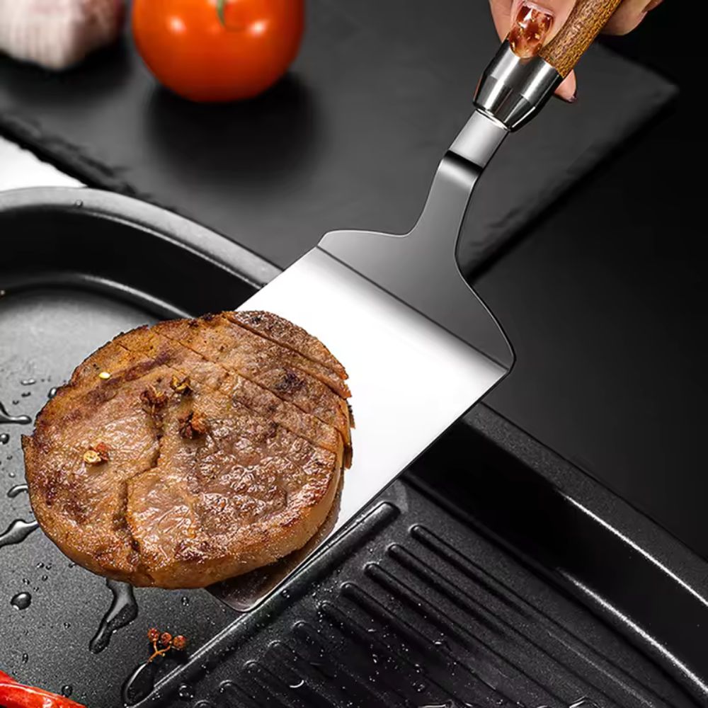 Stainless Steel Kitchen Spatula with Wooden Handle — product in use