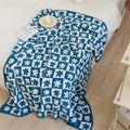 Floriva Checkerboard Daisy Throw Blanket — lifestyle shot