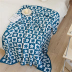 Floriva Checkerboard Daisy Throw Blanket — lifestyle shot