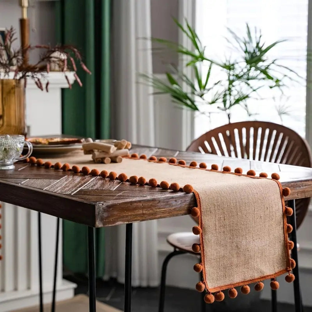 Jute Bohemian Pom-Pom Table Runner — product in use