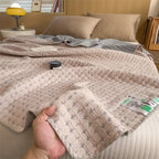 Matelassé Seersucker Reversible Cotton Blanket — product close-up