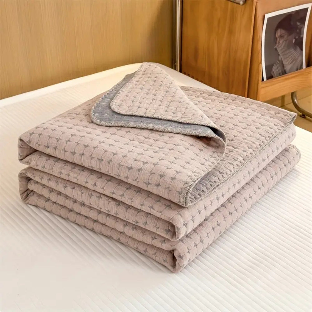 Matelassé Seersucker Reversible Cotton Blanket — product in use