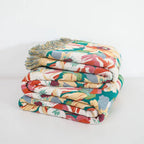 Sunlit Floral Tassel Cotton Blanket — product in use