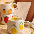 Sunny Fruit Ceramic Mugs — alternate angle view