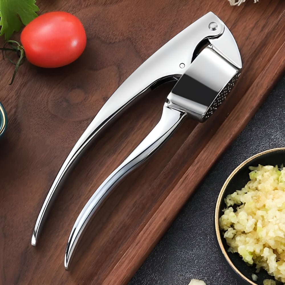 Minimalist Stainless Garlic Squeezer with Non-Slip Handle — product in use