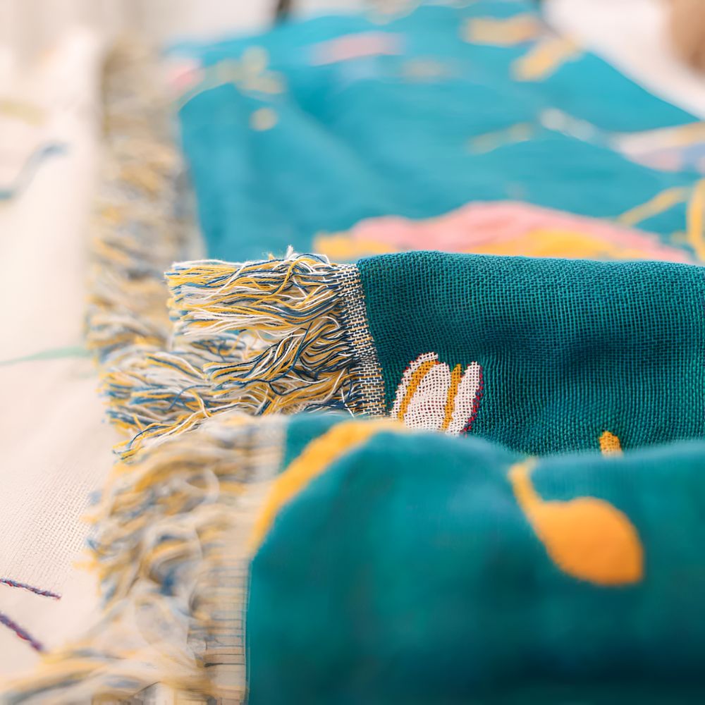 Whimsical Bird Tassel Cotton Blanket — product detail view