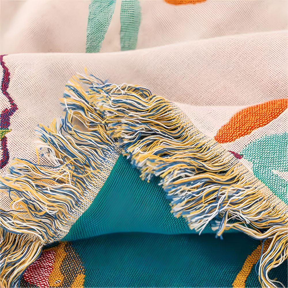 Whimsical Bird Tassel Cotton Blanket — lifestyle shot