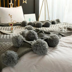 Whimsy Fluffy Pom-Pom Macaron Blanket — product close-up