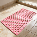 Pink Secure Shower Mat on travertine tile beside a shower screen