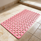 Pink Secure Shower Mat on travertine tile beside a shower screen