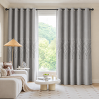 Elysian Leaf Blackout Curtain in Cloud Grey with grommet top on a black rod
