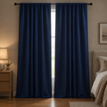 Noiréa Thermal Blackout Curtains in Navy Blue, rod pocket, drawn in a dim bedroom