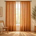 Amber Glow Boho Crochet Curtain, two panels at a window with sunlight filtering through the crochet