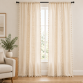 Boho Linen Curtain in natural cream with crochet lace strips and tassel trim, two panels hanging floor-length at a tall white window