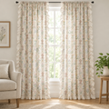 Wildflower Lace Ruffle Curtain, cream botanical print with ruffle trim, two panels hanging floor-length at a tall window in a bright living room