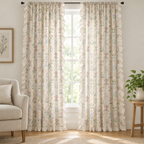 Wildflower Lace Ruffle Curtain, cream botanical print with ruffle trim, two panels hanging floor-length at a tall window in a bright living room