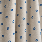 Cottage Petals Tassel Curtain close-up of the blue daisy print on natural linen-look fabric