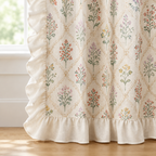 Close-up of Wildflower Lace Ruffle Curtain cream ruffle along the edge and hem