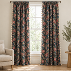 Noveau Ditsy Floral Tassel Curtain in Rosewood Night, pink roses on a dark navy ground, hanging full length at a tall white window