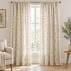 Whimsical Meadow Lace Curtain in cream with green botanical print and crochet lace strip, two panels hanging full length at a tall white window