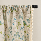 Wildflower Veil Curtain rod pocket top gathered on a black rod, with tassel trim down the edge