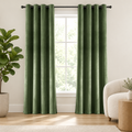 Elegant Soft Velvet Curtain Drapes in grass green, grommet top, framing a window in a bright living room