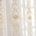 Close-up of the embroidered rose medallion on the Elyvia sheer tulle curtain