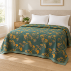 Jacquard Floral Ginkgo Leaves Reversible Coverlet – spread over a made bed in a bright bedroom with plain white pillows