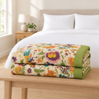 Soft Blossom Breeze Coverlet – folded on a bench at the foot of the bed
