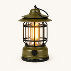 Retro Glow vintage LED lantern in Army Green, switched on with a warm glow