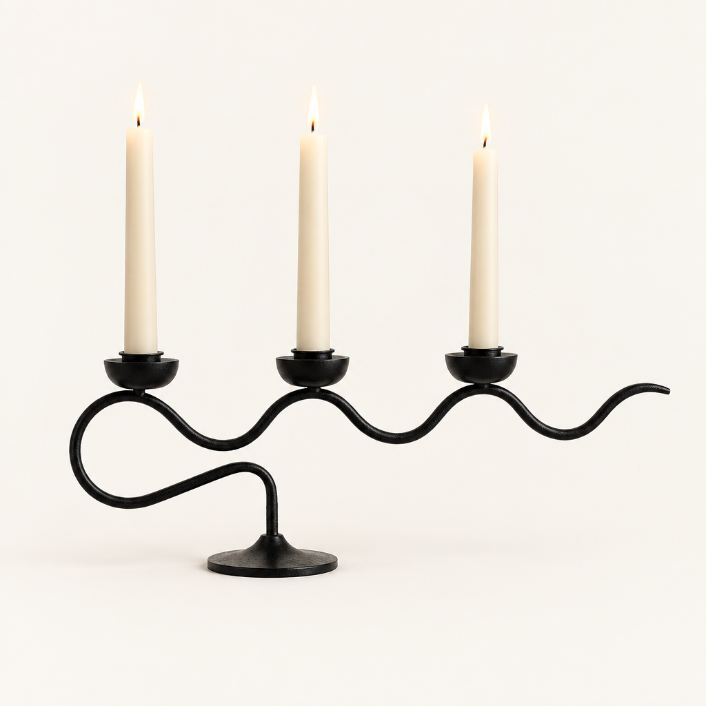 Tri Iron Twisted Candle Holder in Black Swirl with three lit ivory taper candles