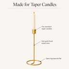 Gold taper candlestick features: taper cup, slim metal stem, open ring base