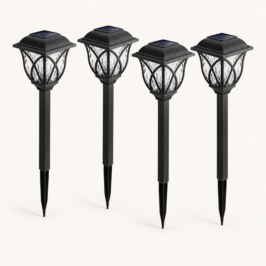 Four black solar garden stake lanterns with solar panels on top