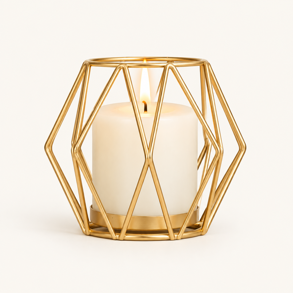 Geometric Gold wireframe candle holder with a lit pillar candle on a warm off-white background