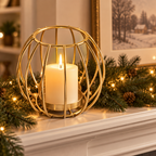 Sculptural Gold wire candle holder on a holiday fireplace mantel with garland