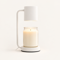 Calla candle warmer lamp in white with cylinder shade warming a jar candle
