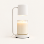 Calla candle warmer lamp in white with cylinder shade warming a jar candle